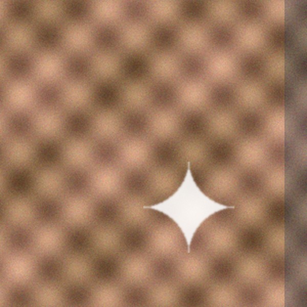 Corner of a woven pattern with a white sparkle